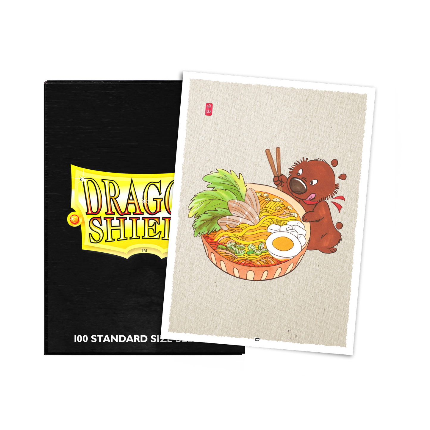 A black Dragon Shield deck box with a yellow "DRAGON SHIELD" logo and a separate art card featuring a brown bear eating ramen. Brand: Dragon Shield, Item: 8th Place Dave Snug Ramen - Brushed Art Sleeves - Standard Size.