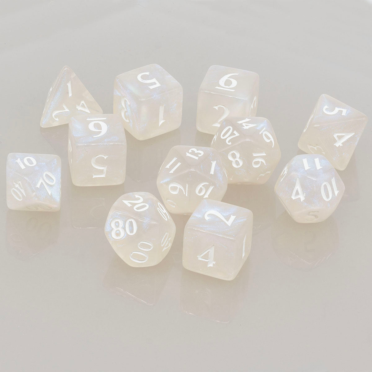 A pearlescent Arctic White Acrylic RPG Dice Set (11ct) from Ultra PRO.