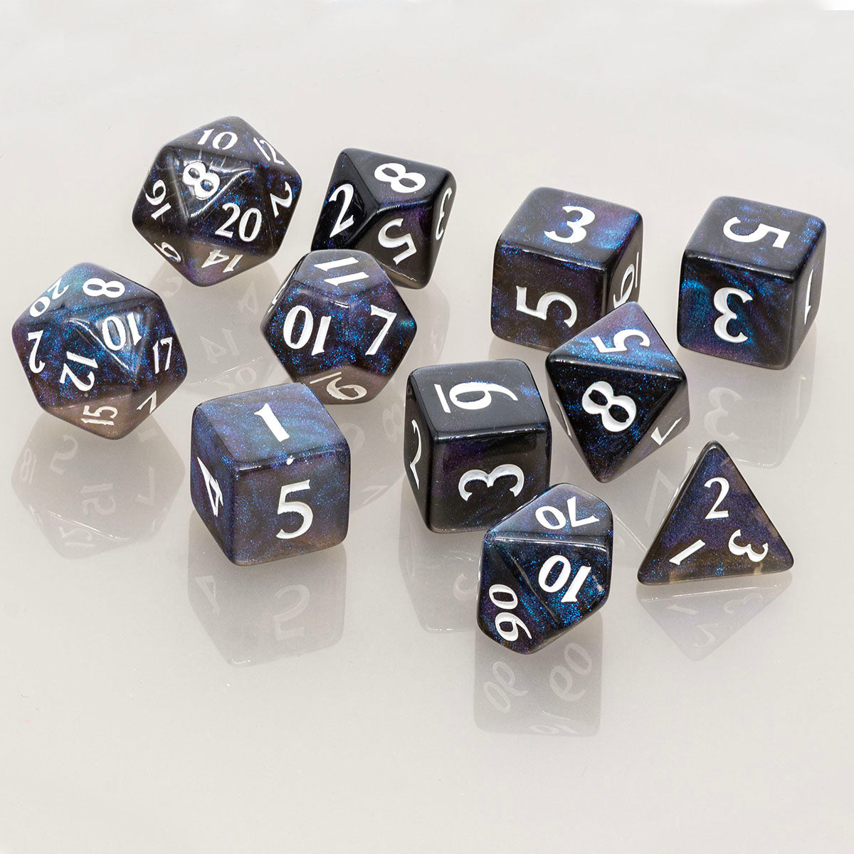 A set of 11 RPG dice in Jet Black with a galaxy-like swirl pattern. Brand: Ultra PRO, Item: ECLIPSE® Acrylic RPG Dice Set (11ct) - Jet Black.
