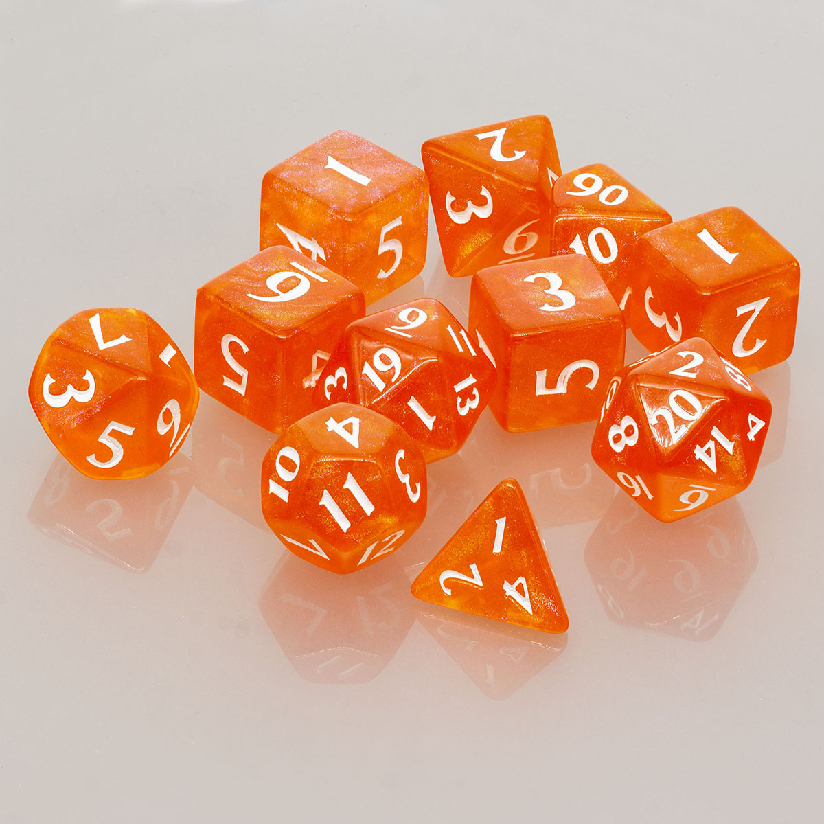A set of 11 orange acrylic RPG dice from Ultra PRO's ECLIPSE line.