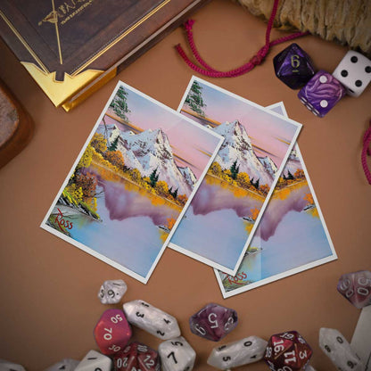 A set of Bob Ross Mighty Mountain Lake APEX DECK PROTECTOR sleeves. Brand: Ultra PRO, Item: Bob Ross Mighty Mountain Lake 105ct APEX DECK PROTECTOR® Sleeves.