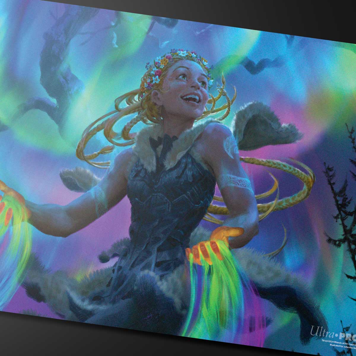 A vibrant and colorful playmat featuring the Magic: The Gathering character Esika, adorned with a flower crown and emitting colorful energy from her hands, set against a backdrop of aurora borealis and silhouetted trees. Brand: Ultra-Pro, Item: Commander Series #4 Shard - Esika Double-Sided Standard Gaming Playmat.