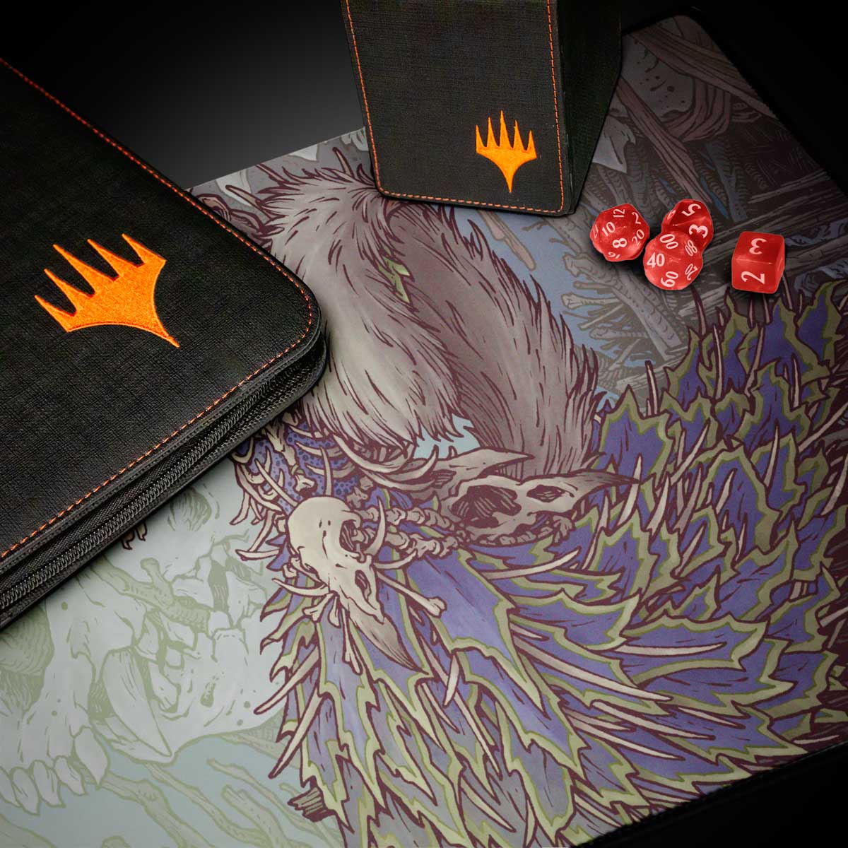 A black Magic: The Gathering deck box and binder with orange Magic: The Gathering logos, placed on a playmat featuring artwork of a creature with a skull and purple/green foliage. Brand: Magic: The Gathering, Item: Bloomburrow Camellia, the Seedmiser Playmat.