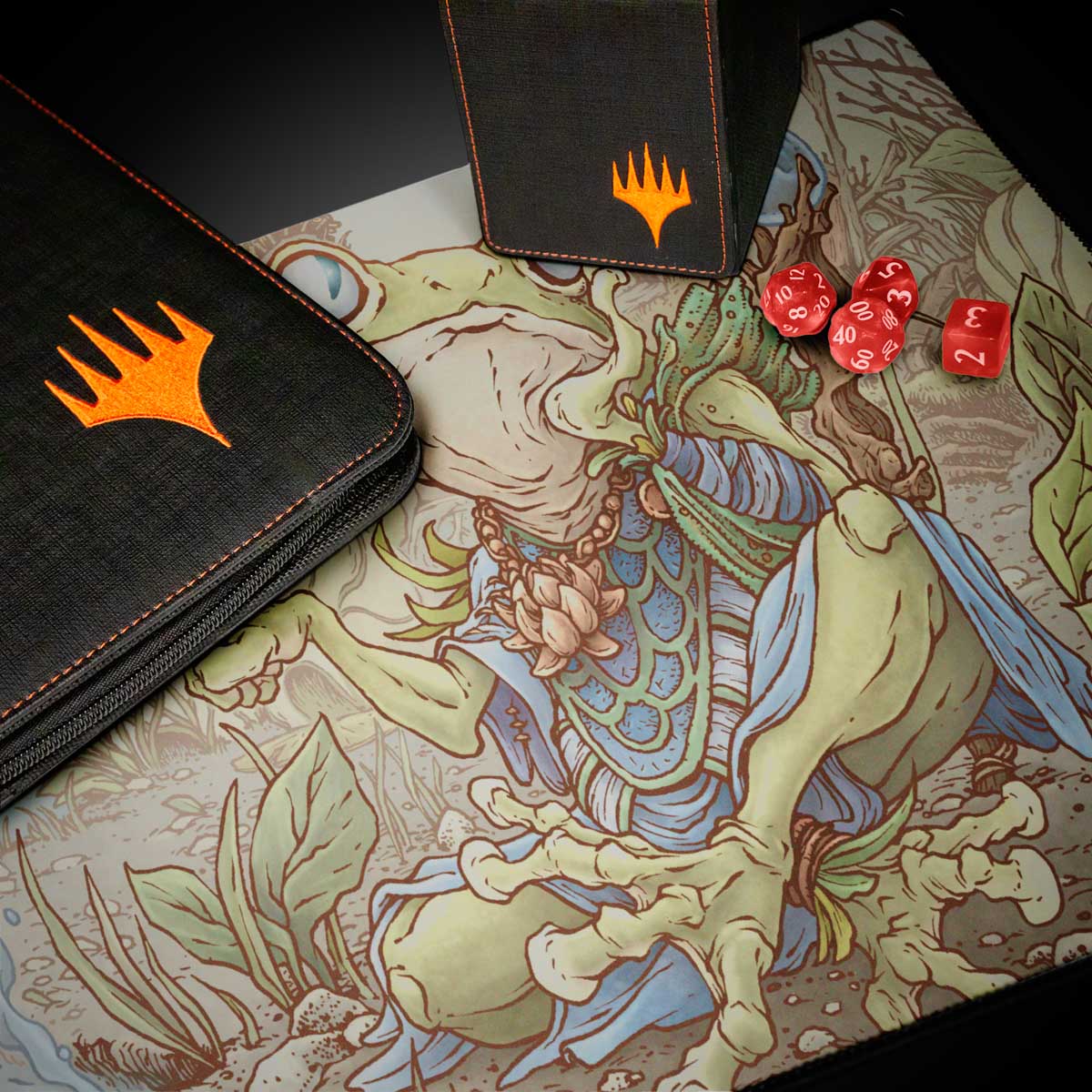 A black Magic: The Gathering deck box and binder with orange Magic: The Gathering logos, alongside red dice and a playmat featuring the Bloomburrow Helga, Skittish Seer artwork.