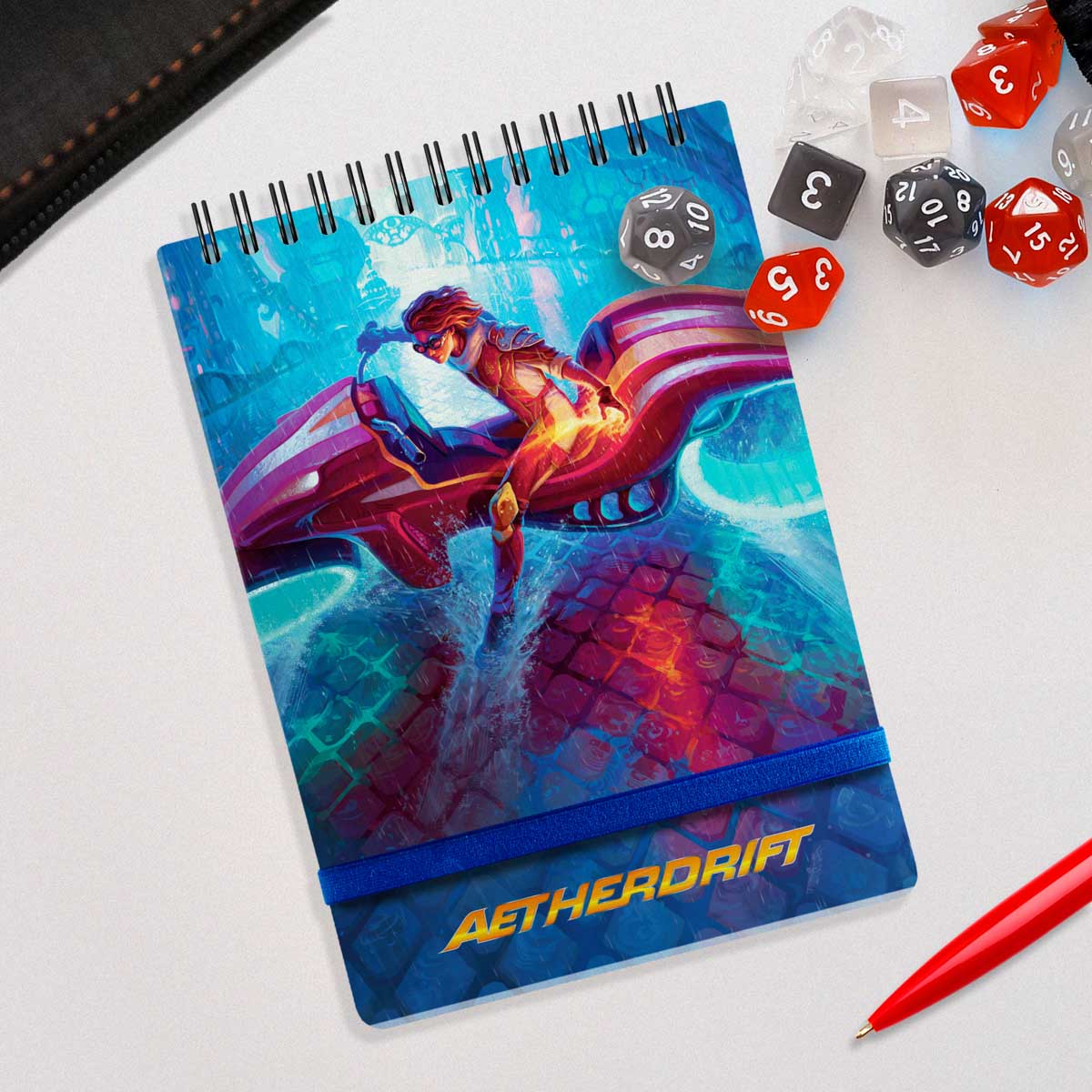 A blue Aetherdrift Chandra Spiral Life Pad for Magic: The Gathering by Ultra PRO. Features a vibrant artwork of Chandra Nalaar riding a vehicle.