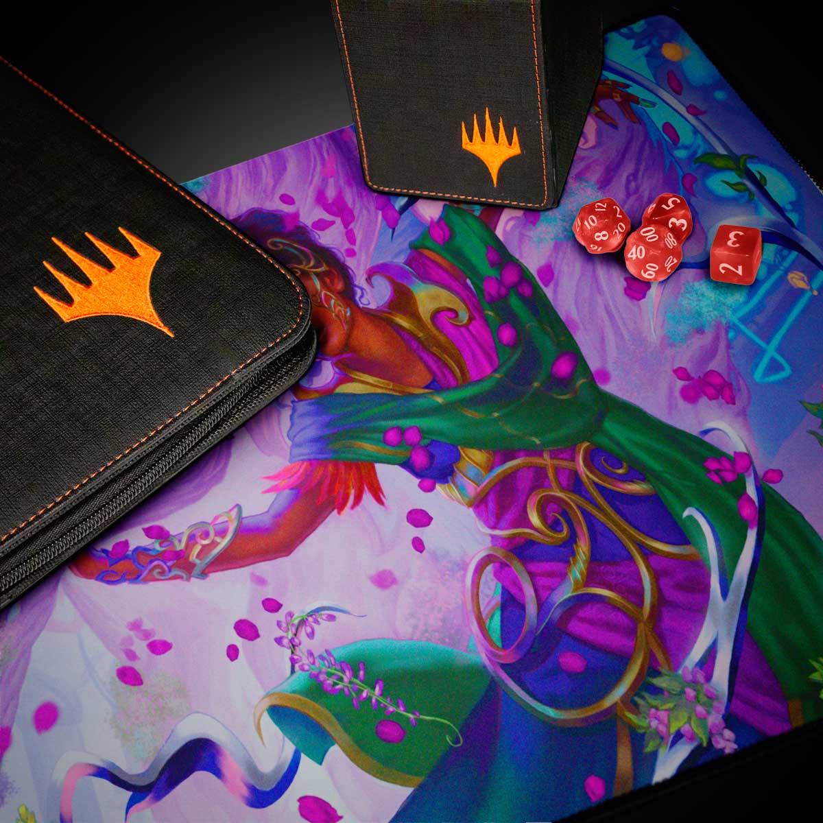 A black Magic: The Gathering deck box and binder with orange Magic: The Gathering logos, placed on a playmat featuring the Aetherdrift Avishkar Living Energy artwork. Three red dice are also visible on the playmat. Brand: Magic: The Gathering, Item: Aetherdrift Avishkar Living Energy (Commander) Playmat.