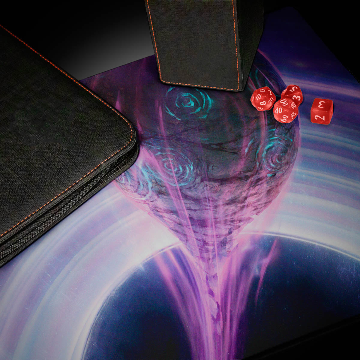 A black zippered deck box and a black dice box with orange stitching on a playmat featuring a purple and blue cosmic scene with a black hole.
