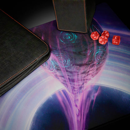 A black zippered deck box and a black dice box with orange stitching on a playmat featuring a purple and blue cosmic scene with a black hole.