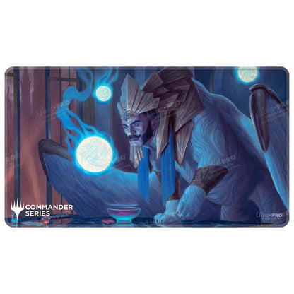 A blue and white creature with a golden headdress holding a glowing orb, on a playmat. Brand: Ultra PRO, Item: Commander Series #8 Tivit, Seller of Secrets Stitched Playmat for Magic: The Gathering