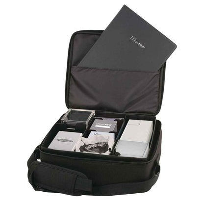 A black Ultra PRO Deluxe Gaming Case with black trim, featuring compartments for cards and accessories.