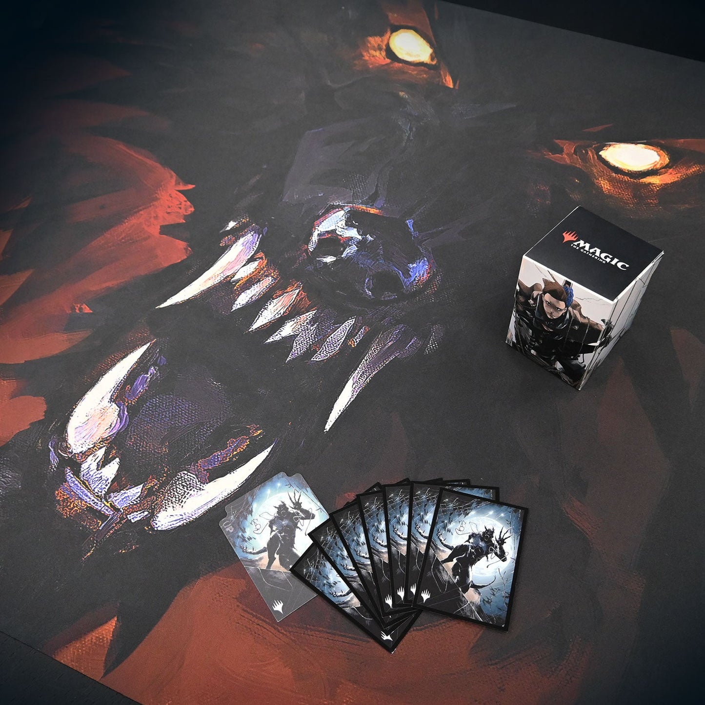 A dark, illustrated playmat featuring the key art from Magic: The Gathering's Innistrad: Midnight Hunt set, with a deck box and several cards on top.