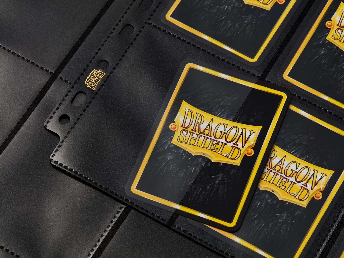 A black 18-pocket page for trading cards. Brand: Dragon Shield, Item: 18 Pocket Pages - Non-Glare - Standard Size.