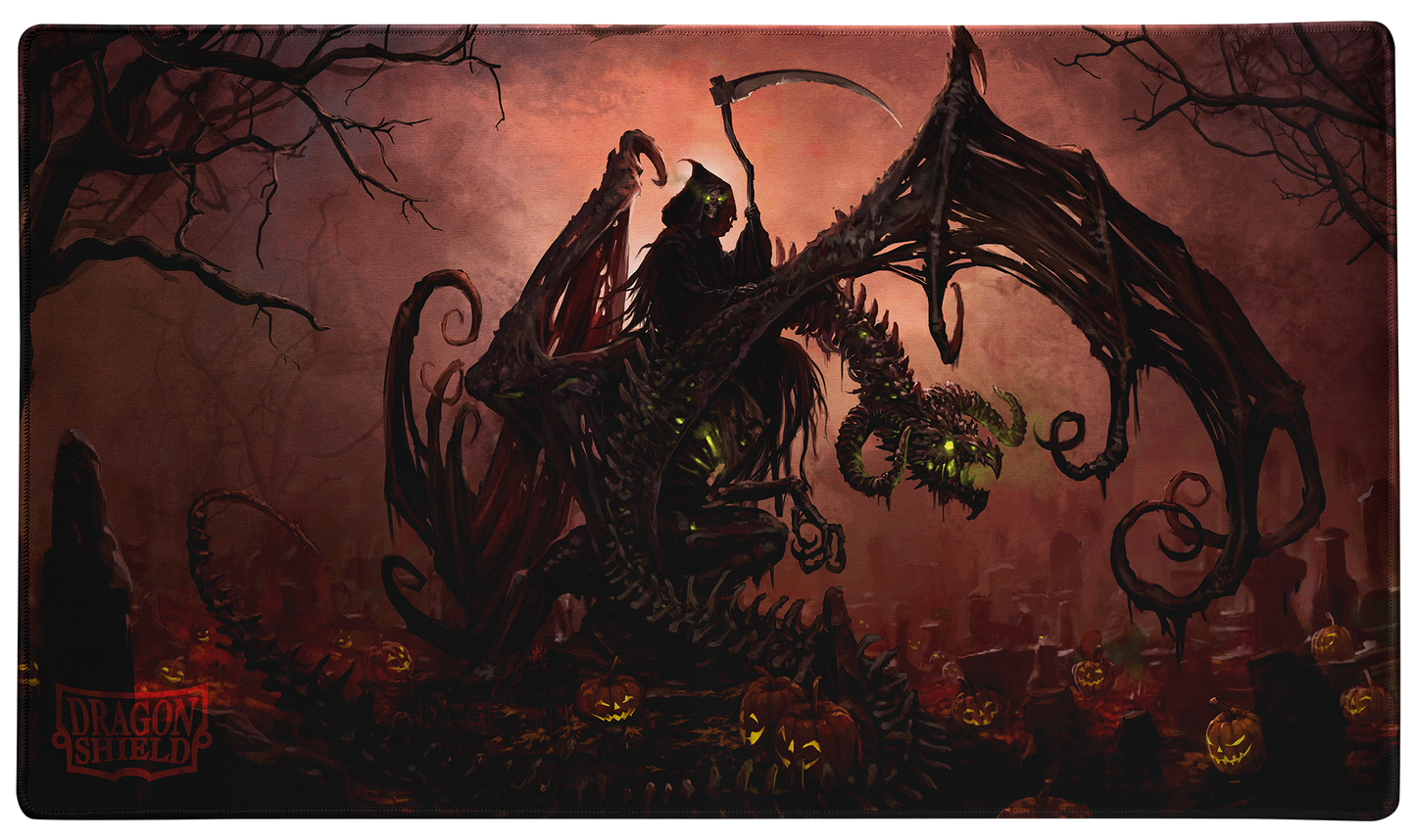 A dark fantasy TCG Playmat featuring the Grim Reaper riding a skeletal dragon through a graveyard filled with jack-o'-lanterns. Brand: Dragon Shield (Dev), Item: Halloween 2025 - TCG Playmat.