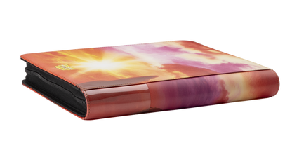 A sunset-themed Card Codex Zipster Binder. Brand: Wood Dragon, Item: 2024 - Card Codex Zipster Binder - Regular.