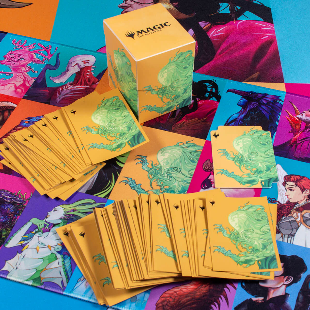 A Magic: The Gathering Commander Masters Pop Collage 8ft Table Playmat featuring various card art and a deck box.