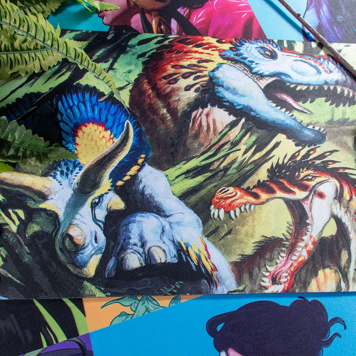 A vibrant "Finale of Devastation" Magic: The Gathering playmat featuring a prehistoric scene with dinosaurs and lush foliage.