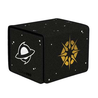 A black textured deck box with white and gold cosmic designs. Brand: Ultra PRO, Item: Edge of Eternities Adagia, Windswept Bastion ALCOVE® Edge DECK BOX®