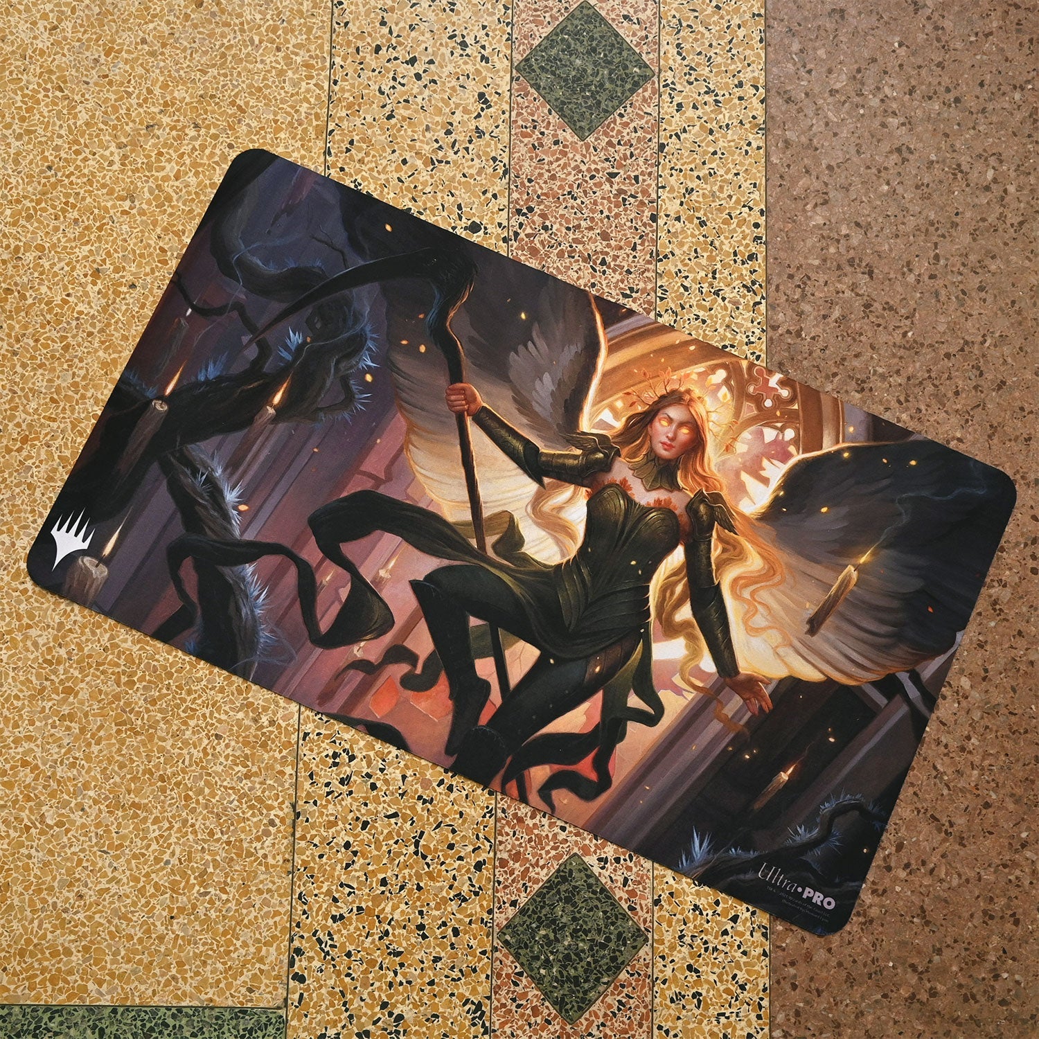 A Magic: The Gathering playmat featuring Sigarda, Champion of Light from Innistrad: Midnight Hunt. Brand: Ultra PRO, Item: Innistrad: Midnight Hunt Sigarda, Champion of Light Standard Gaming Playmat