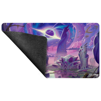 A purple and blue alien landscape playmat featuring strange architecture and a black hole, with the Ultra Pro logo in the bottom right corner.
