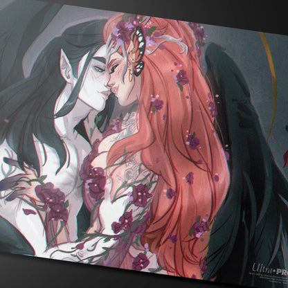 A Vax and Keyleth playmat featuring an intimate embrace, adorned with flowers and a butterfly. Brand: Ultra PRO, Item: Critical Role Pinups - Vax and Keyleth Playmat.