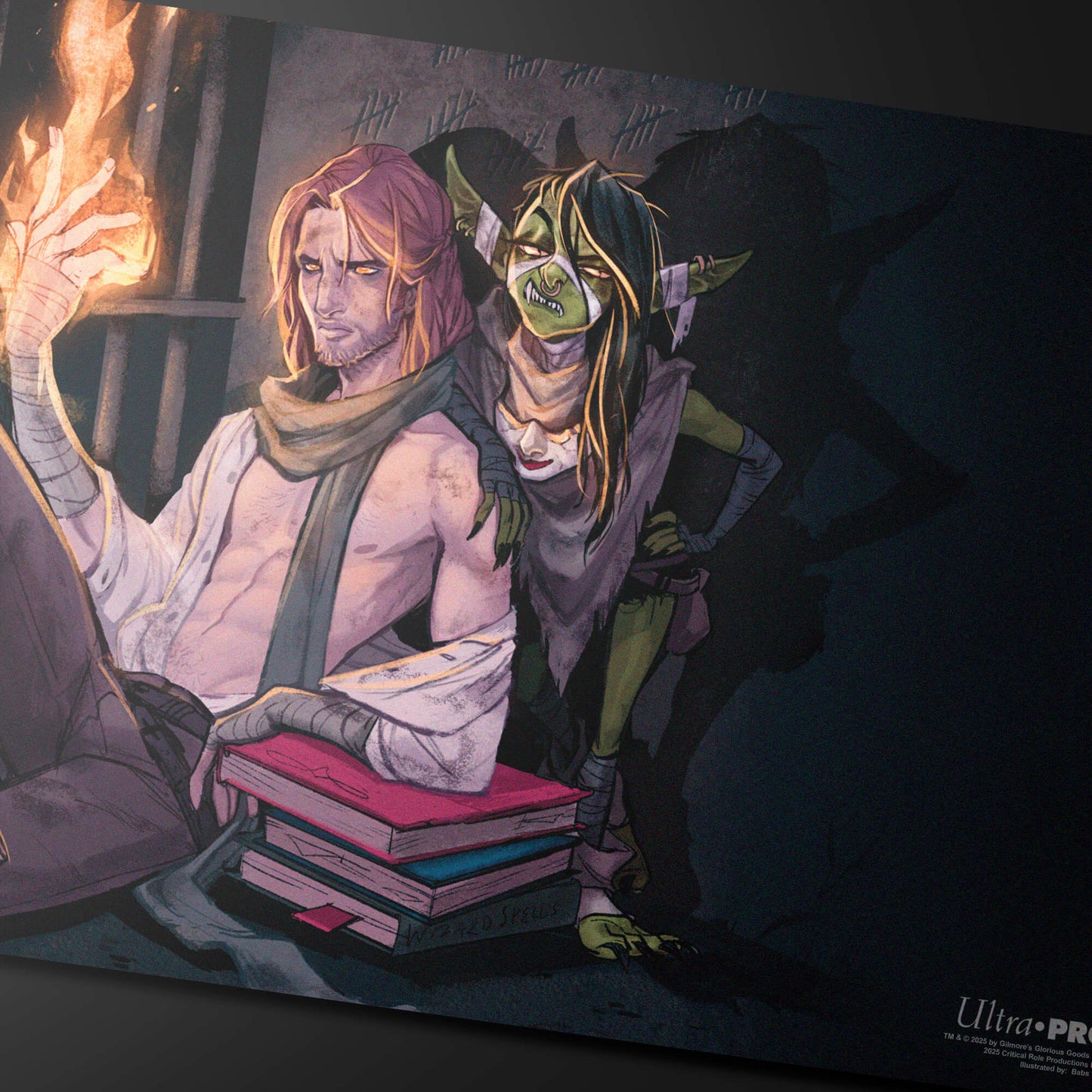 A fantasy art playmat featuring Caleb Widogast and Nott the Brave from Critical Role, with Caleb conjuring fire and Nott leaning on him.