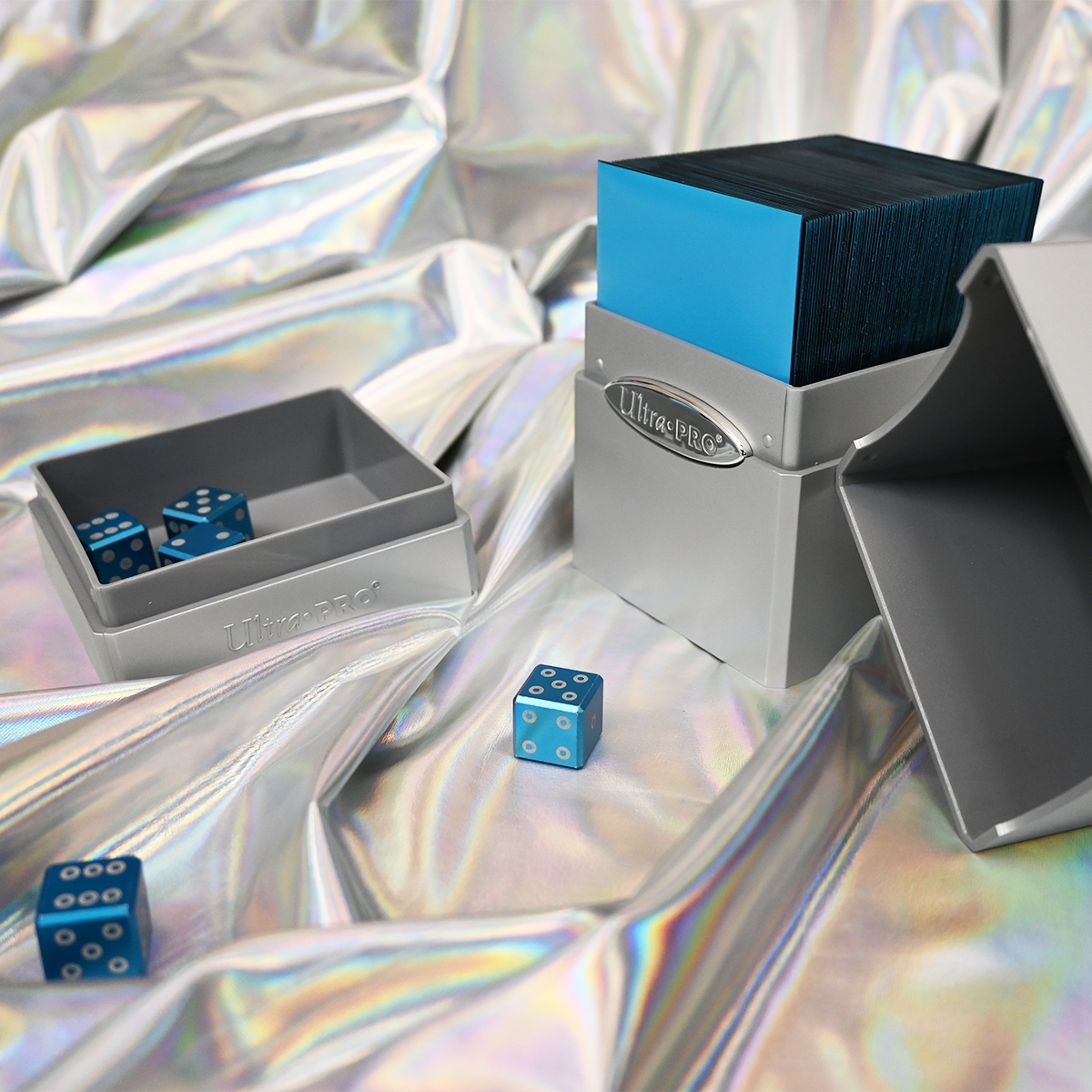 A silver Classic SATIN Tower DECK BOX with blue dice. Brand: Ultra PRO, Item: Classic SATIN® Tower DECK BOX®