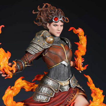 A detailed statue of Chandra Nalaar from Magic: The Gathering, featuring fiery effects and intricate armor.