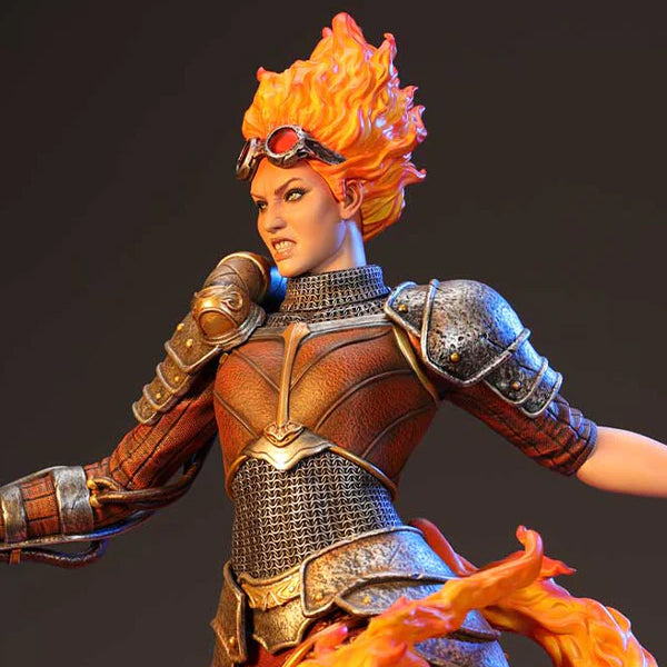 A detailed statue of Chandra Nalaar from Magic: The Gathering, featuring fiery hair and intricate armor.