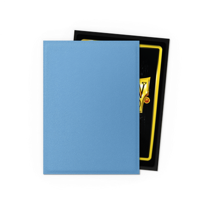 A light blue matte Japanese Dragon Shield card sleeve with a black border and yellow accents visible on a card inside. Brand: Dragon Shield (Dev), Item: Lagoon - Matte Dual Sleeves